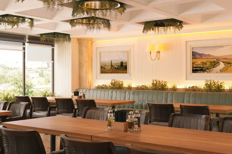 Afiyet Et Restoran konsepti, yeşil döşemeli sedir, ahşap masalar ve tavandan sarkan bitkiler