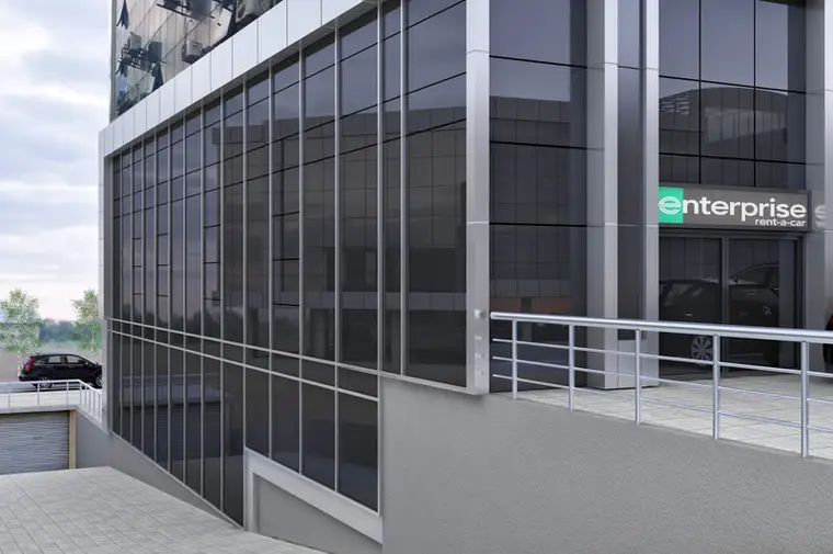 Gürbaşlar Plaza dış cephesi, koyu cam giydirme cephe sistemi ve zemin kat şube girişi